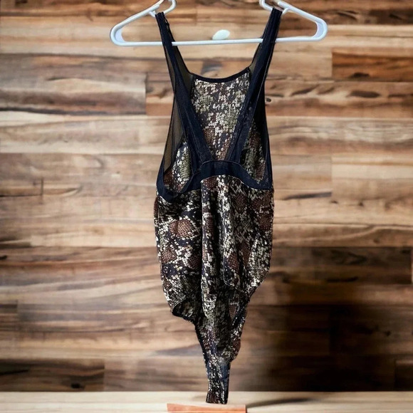 Free People Intimately Snakeskin bodysuit with lace trim. NWOT’s.  Size S/P - Picture 2 of 6